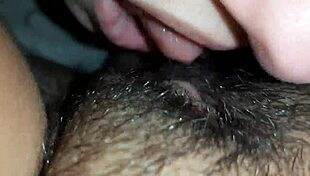 The brunette lesbian dives deep into her lover's hairy wet pussy up close