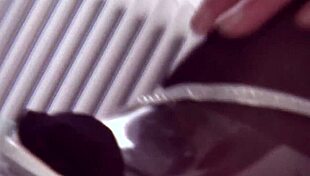 Euro milf in heels and stockings rubs pierced pussy on cam