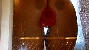 Pretty girl teases appetizing ass in shower with pink toy