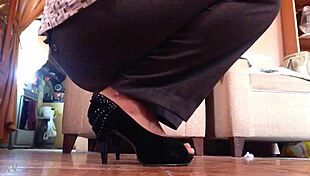 check out this sexy shemale strutting in her black high heels like a total tease