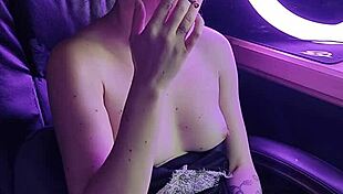 a beautiful lady's cigarette smoke hints at deeper sexy cravings