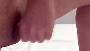 Asian shemale with big ass tits and monster cock strokes hard solo on webcam in her bed masturbating wet.