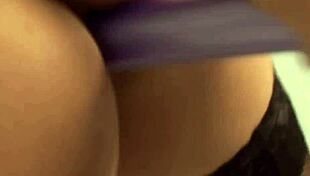 Dialogic Diamond flaunts her big tits and curves in sexy purple corset