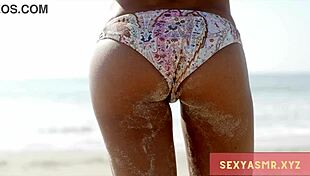 hey check out this sexy beach hottie in her bikini turning heads