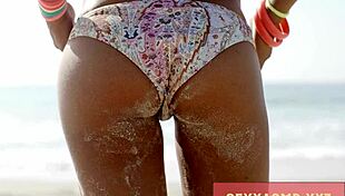 hey check out this sexy beach hottie in her bikini turning heads